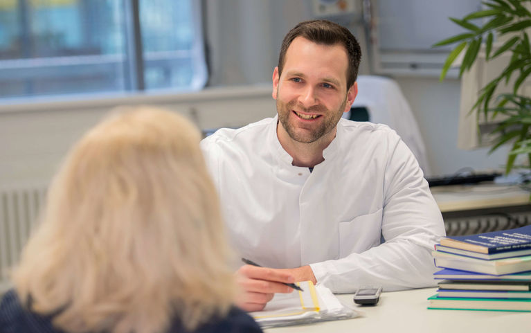 Physician in consultation with patient