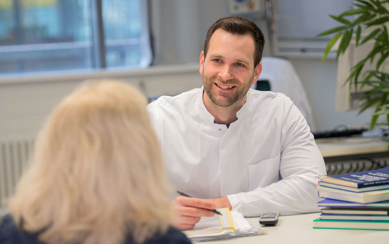 Physician in consultation with patient